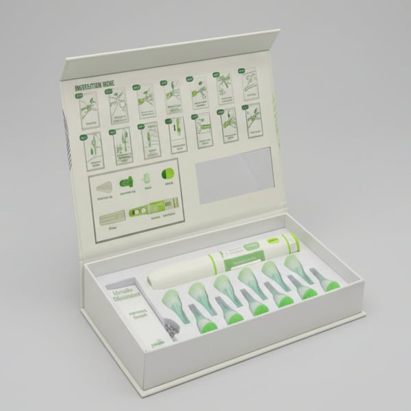 Medical retentive kit with various components and an instruction guide in a box.